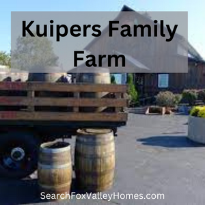 An old farm truck sits in front of a barn near Elburn.